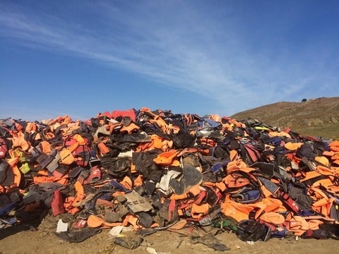 Life Jacket Graveyard on the island of Lesvos, piled with thousands of orange lifejackets