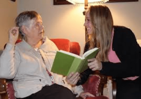 Rachel Thompson, founder of Marlena Books, reading with her grandmother