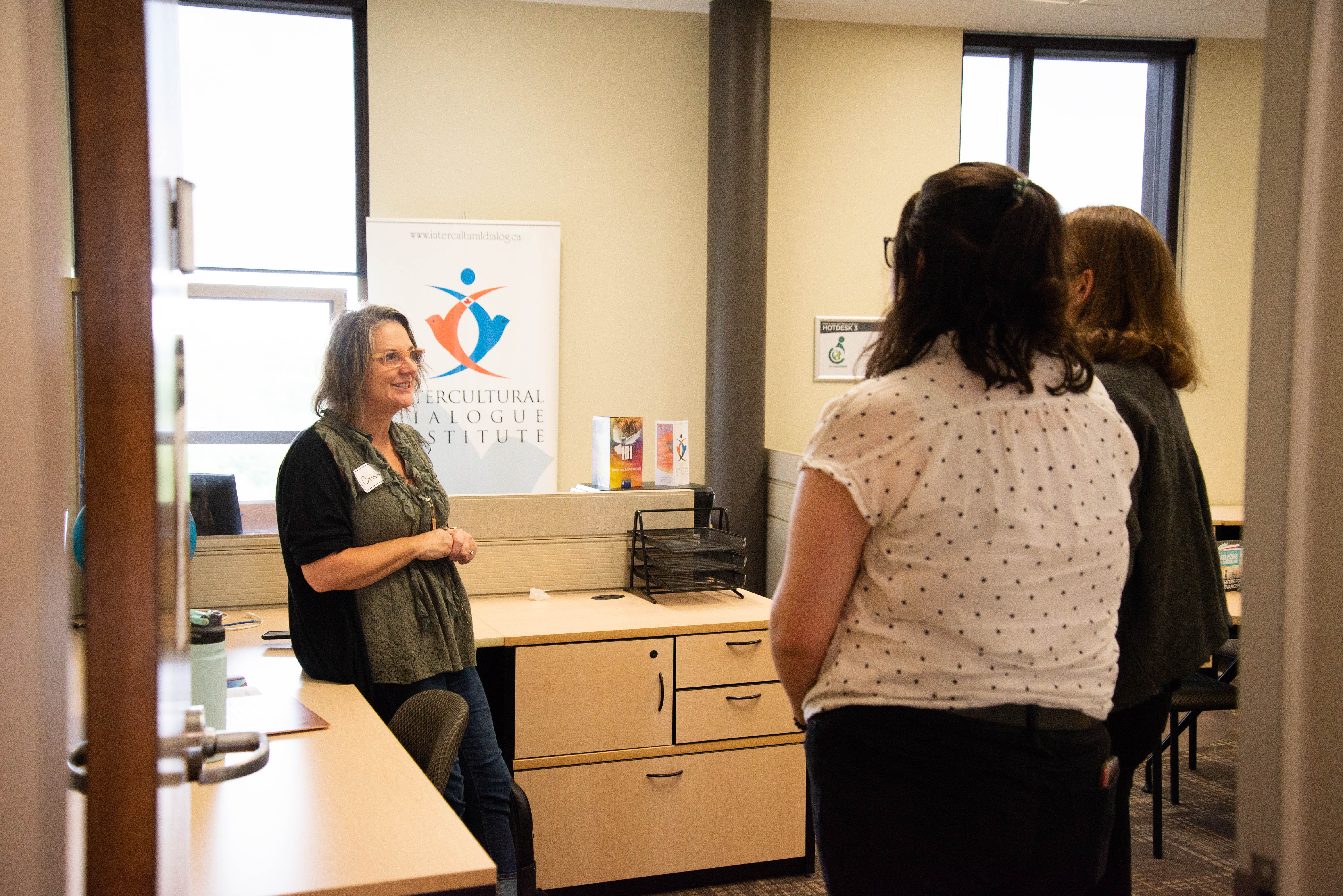 Visitors to the CPA chatting in Peace Incubator room