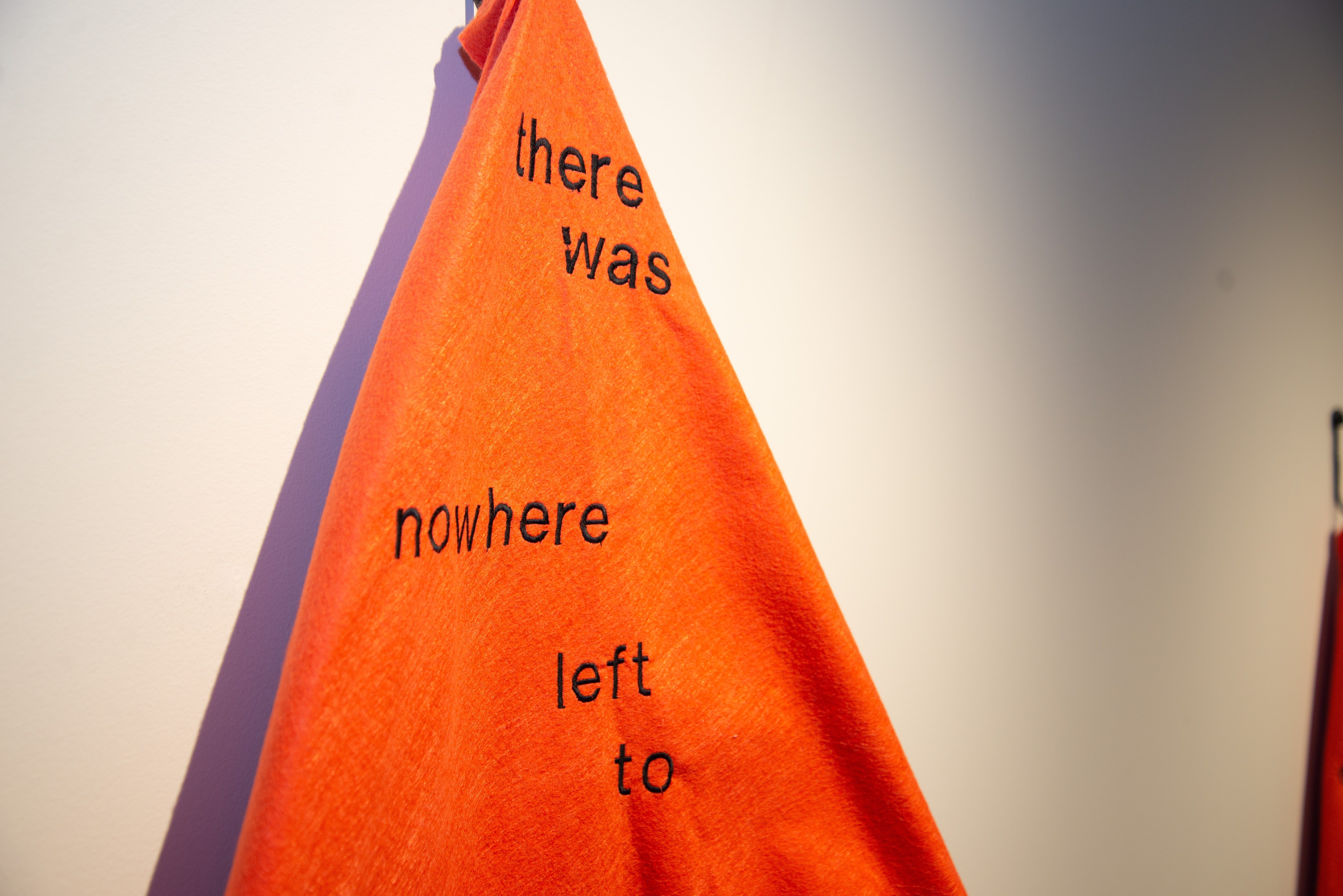 Orange blanket hanging in Grebel Gallery