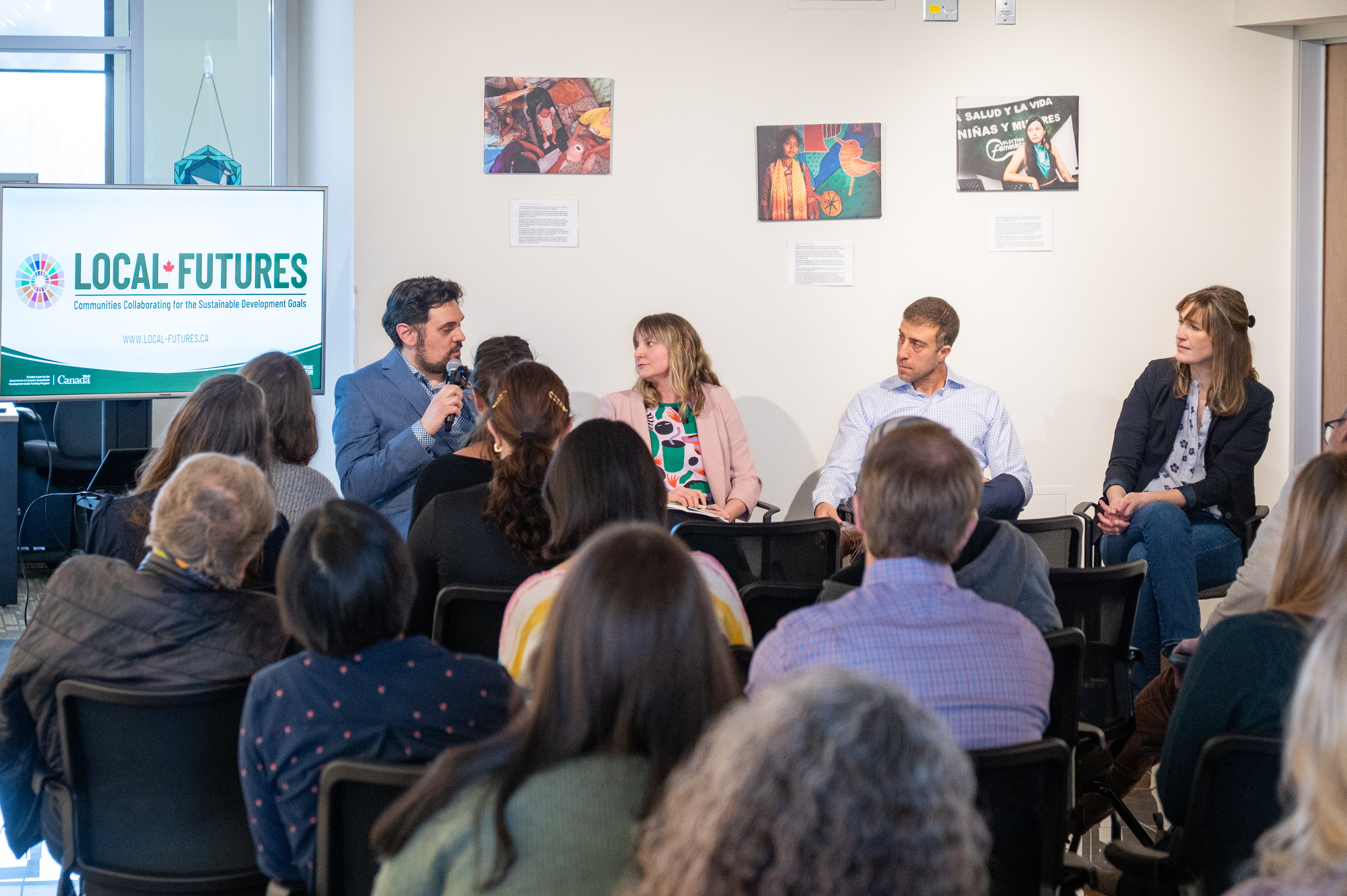Local Futures staff presenting in front of a crowd