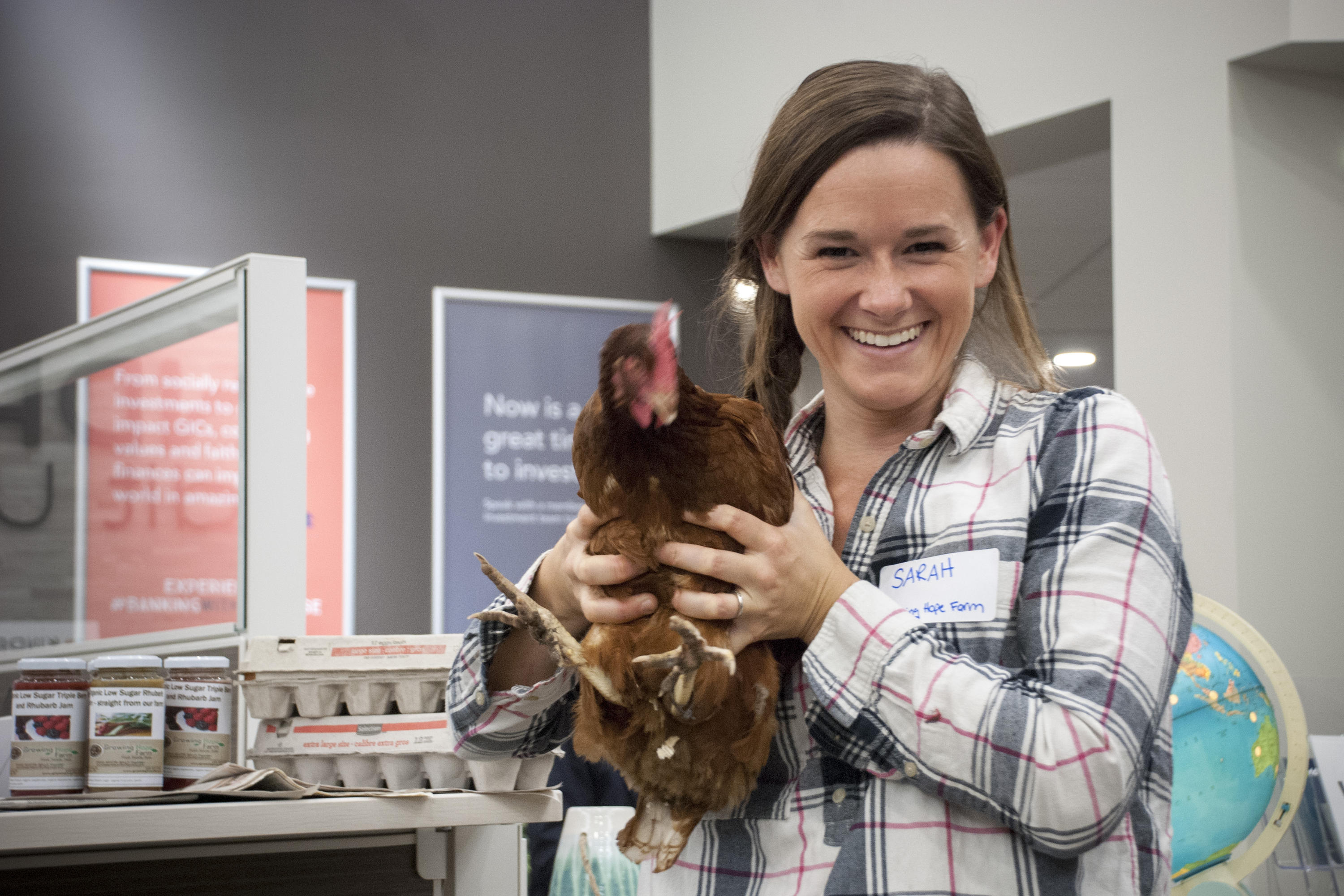 Sarah Martin-Mills is holding a chicken