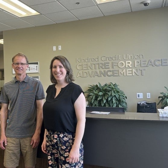 paul-and-kate-in-front-of-the-cpa-front-desk smiling