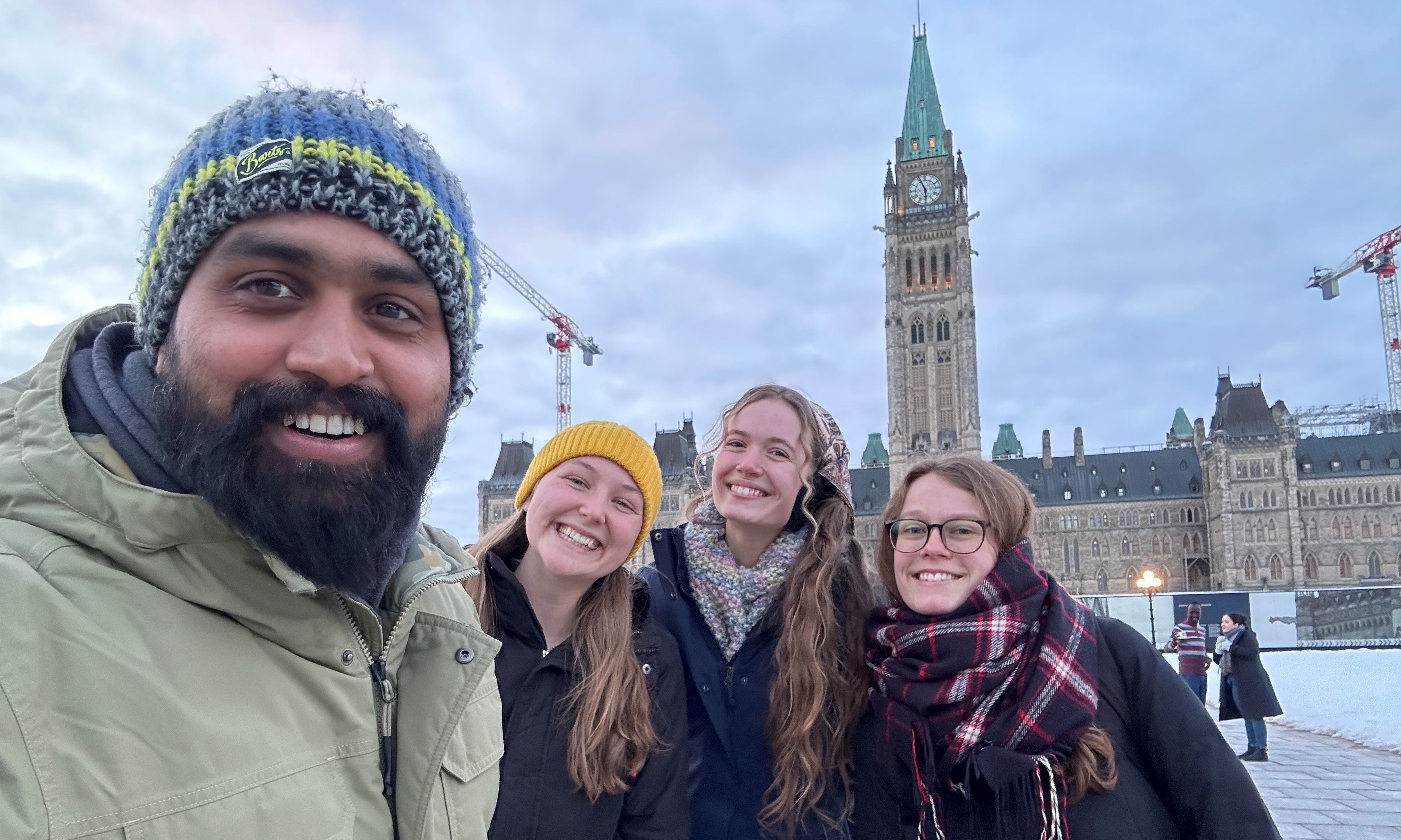 Noman, Eden, Selah, and Eva in front of the Peace Tower in Ottawa