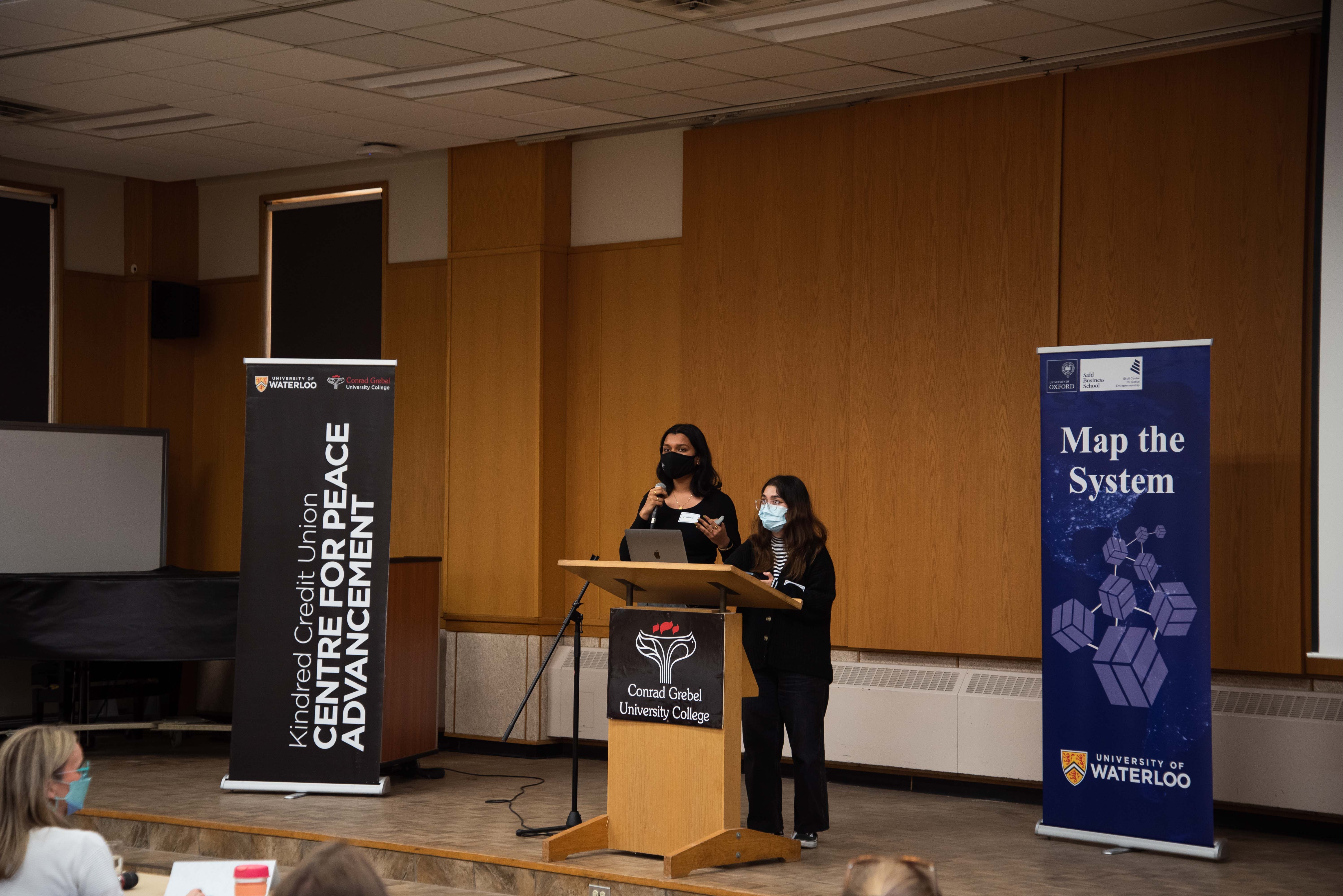 Anu and Krishna presenting at the 2023 campus finals