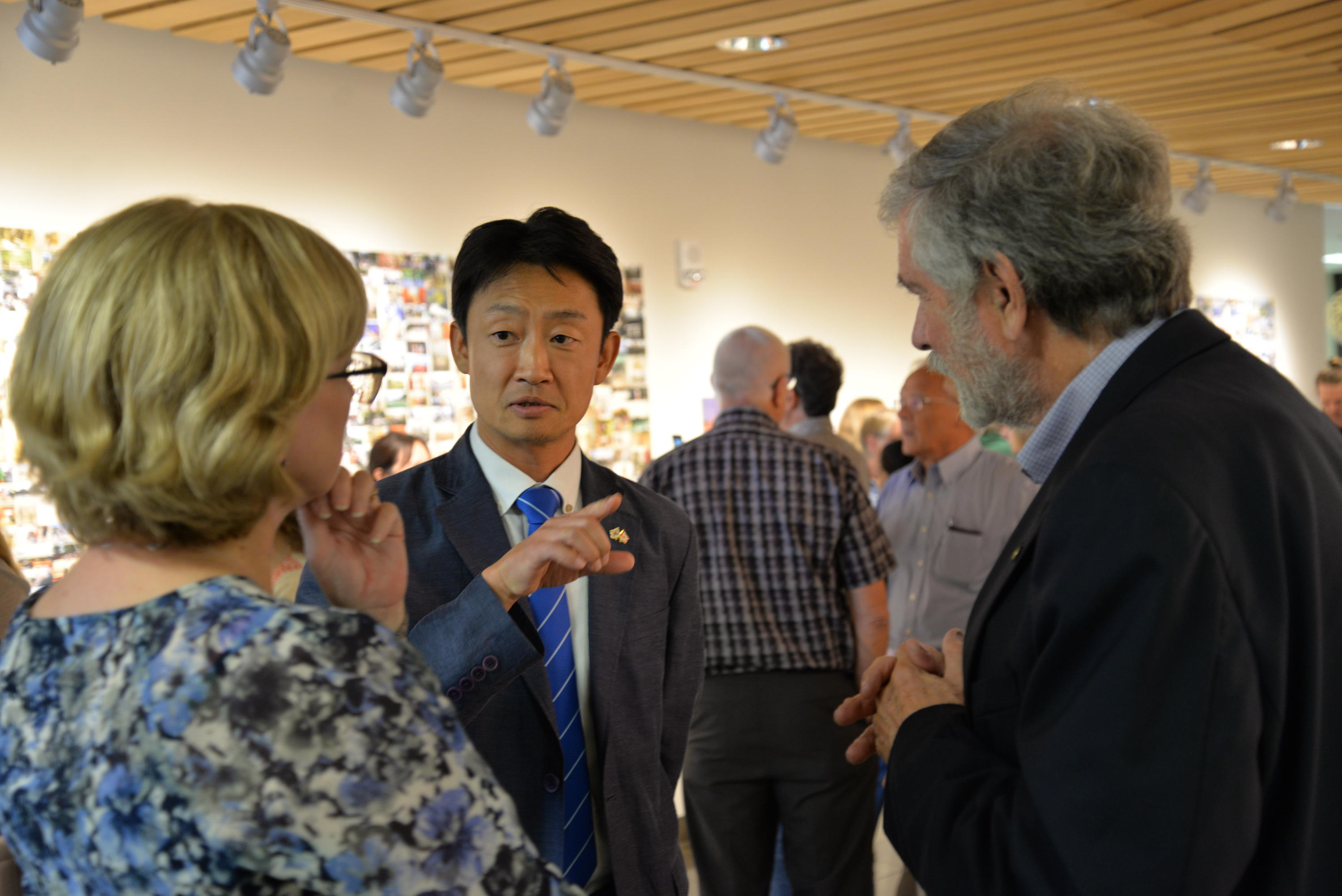 Doug Hosteter speaks with exhibit guests