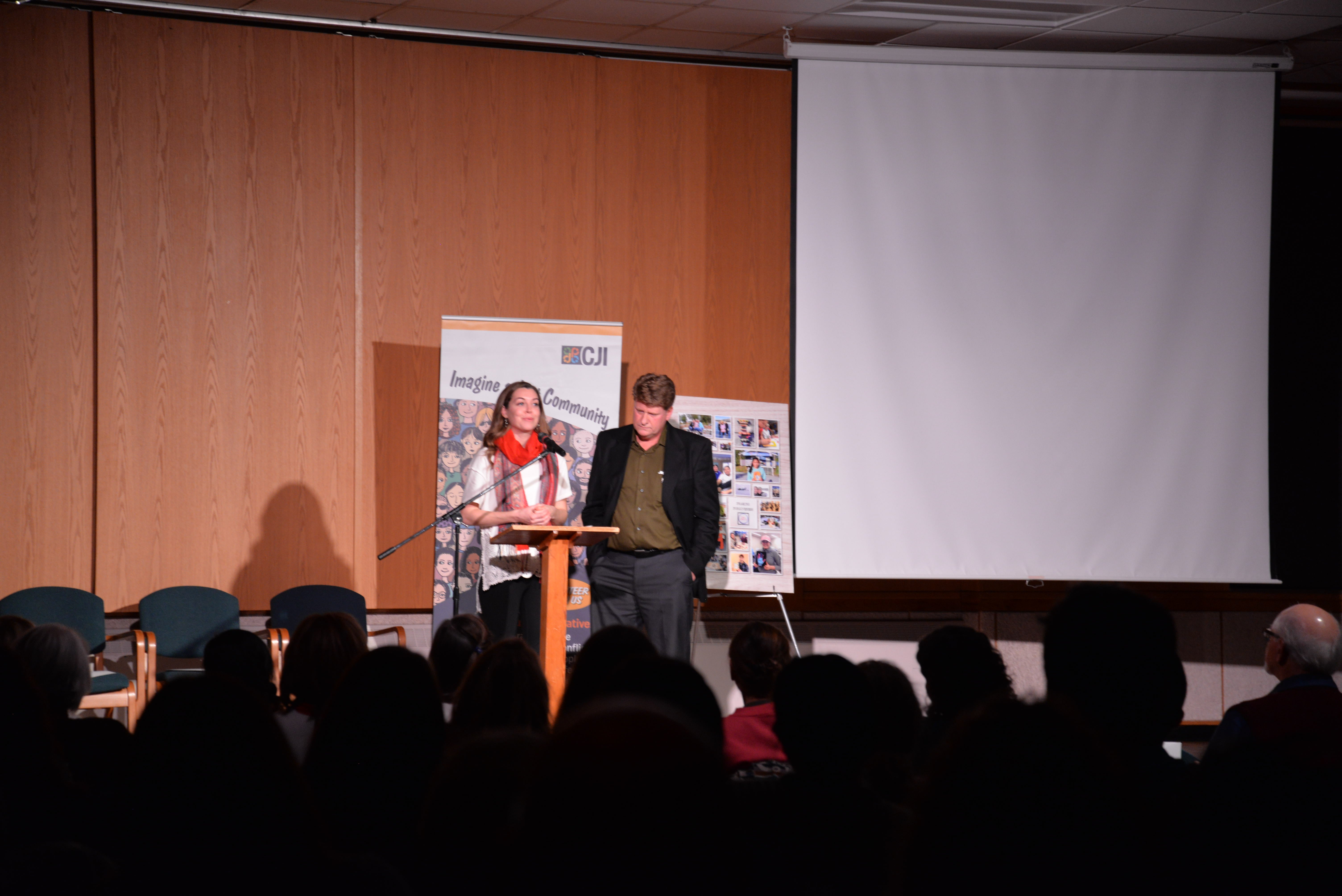 Chris and speaer presenting in Great Hall at Grebel