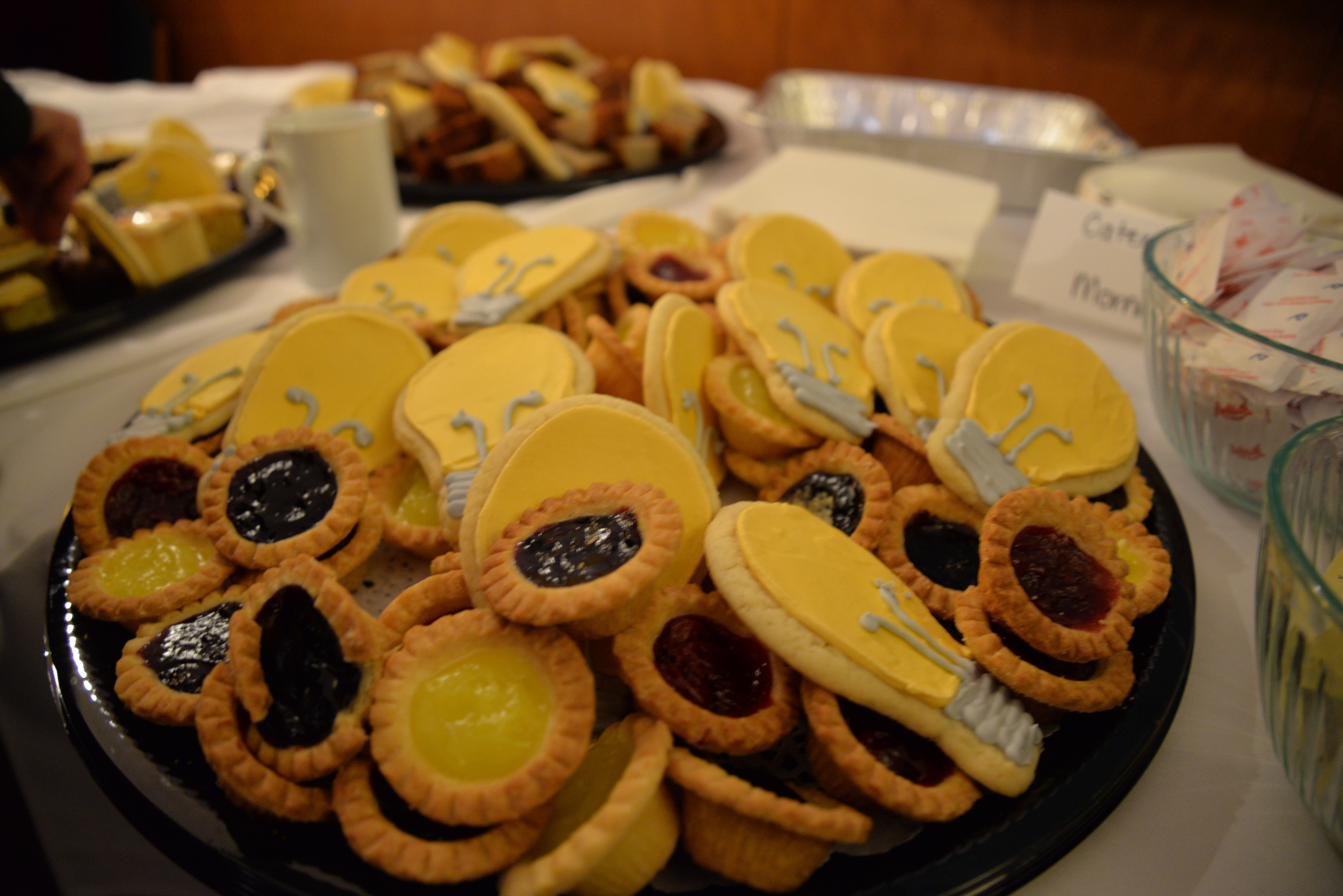 A platter of cookies decorated to look like lightbulbs