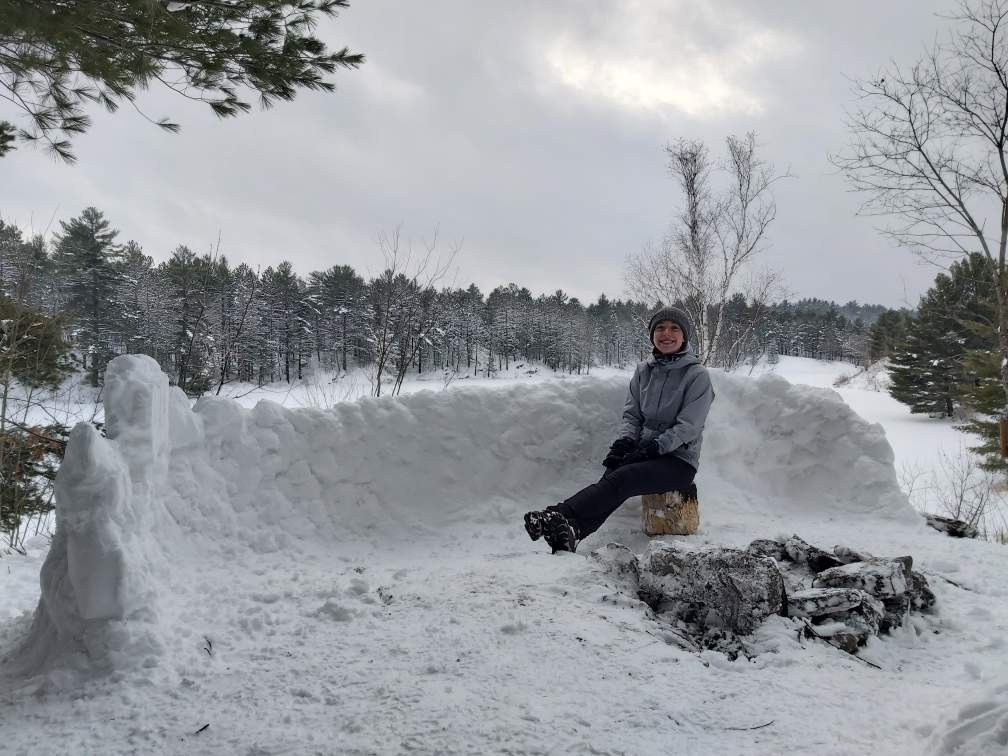 Emily Charron shows off a snow fort that makes her proud