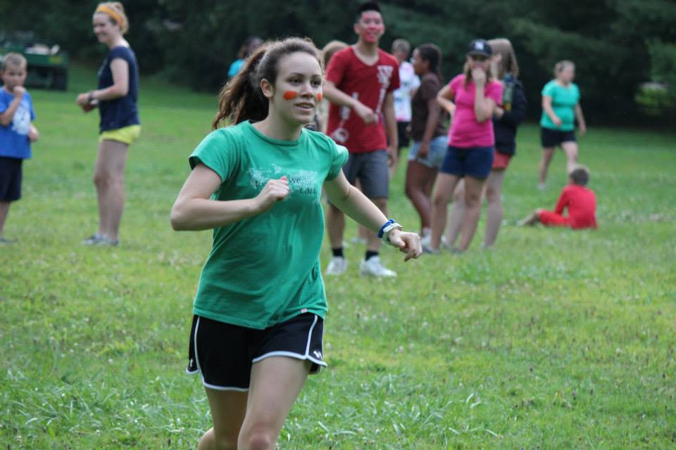 Katie running in a field