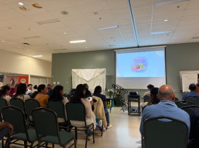 People in a crowd watching a presentation