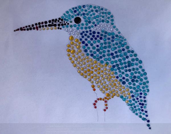 A kingfisher mostly made from mini droplets showing different colours of blue, yellow and red.