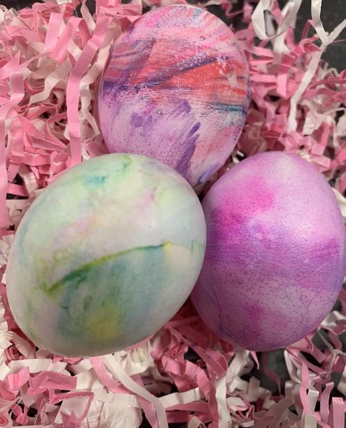 three colourful marbled eggs