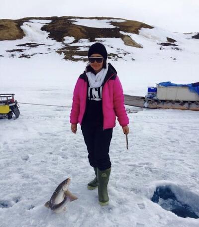 Rosalina Naqitarvik ice-fishing near Ikpiarjuk (Arctic Bay), NU.