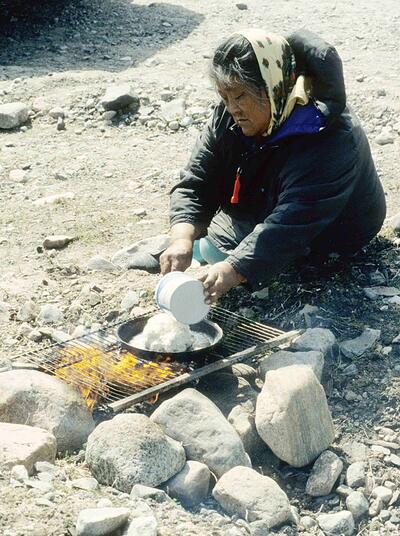Inuk Elder preparing bannock.