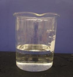 Beaker with clear colourless solution.