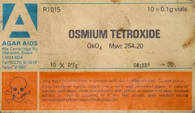 A label of an old bottle of Osmium Tetroxide with information and a skull and crossbones.
