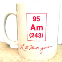 L.O. Morgan's signature on a white mug with the element Am-95