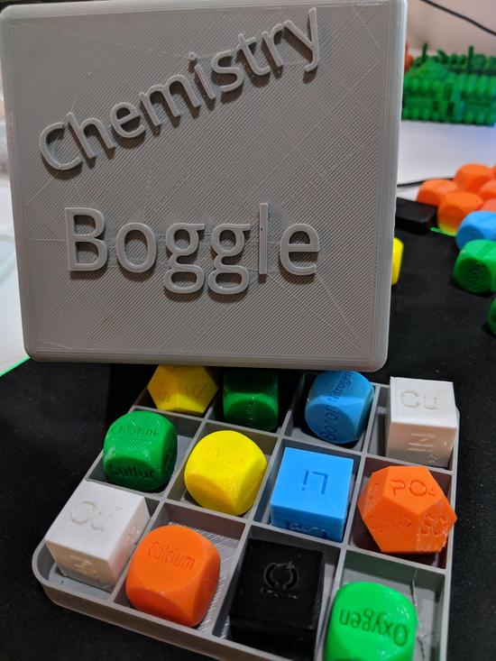 Chemistry Boogle showing 6-sided and 12-sided game dice.