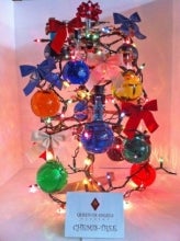 Christmas tree made of colourful flasks and bows.
