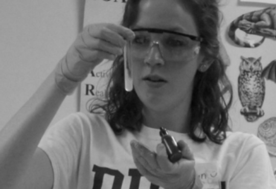 Carolyn Rath holding a test tube 