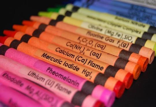bright coloured Crayonal crayons with different chemical compounds written on the label