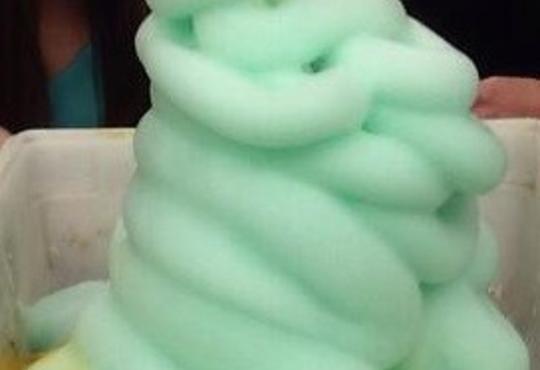 a green foam in the shape of a Christmas tree
