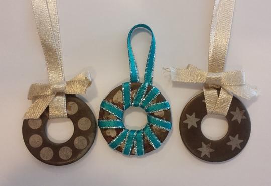 Three metal ring Christmas ornaments.
