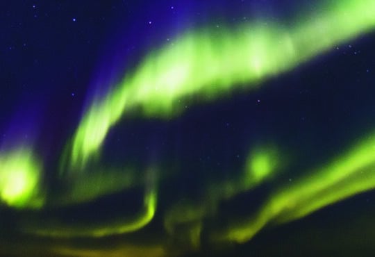 Aurora, showing the blue and green layers, at sea off Kitlineq (Victoria Island), shared between Inuvialuit and Nunavut.