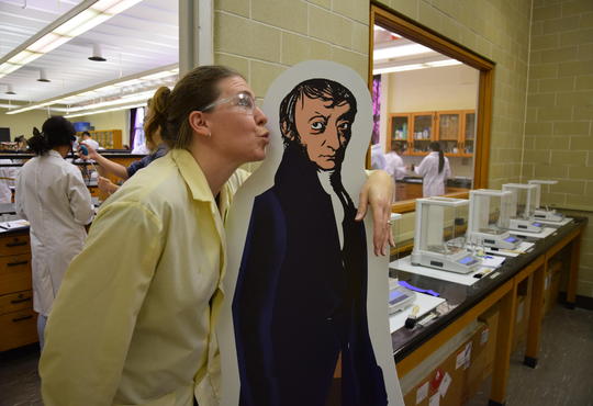 Sue Stathopulos kissing a cardboard cut-out of Avogadro