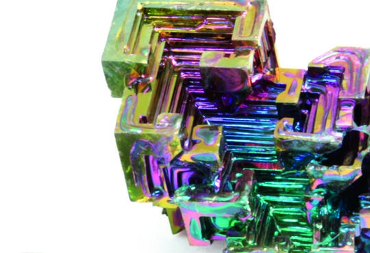 a bismuth crystal showing the iridescent rainbows of colors