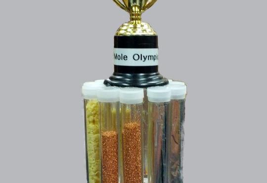 Mole Olympics trophy with a gold cup on top