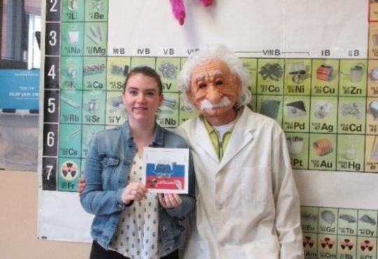 Julia Rombough and her teacher with the winning oganesson tile 