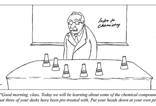 an old professor in front of the class with several flask 