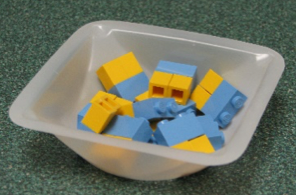 Lego pieces in a weighing boat.