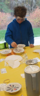 A child with goggles and bowls.