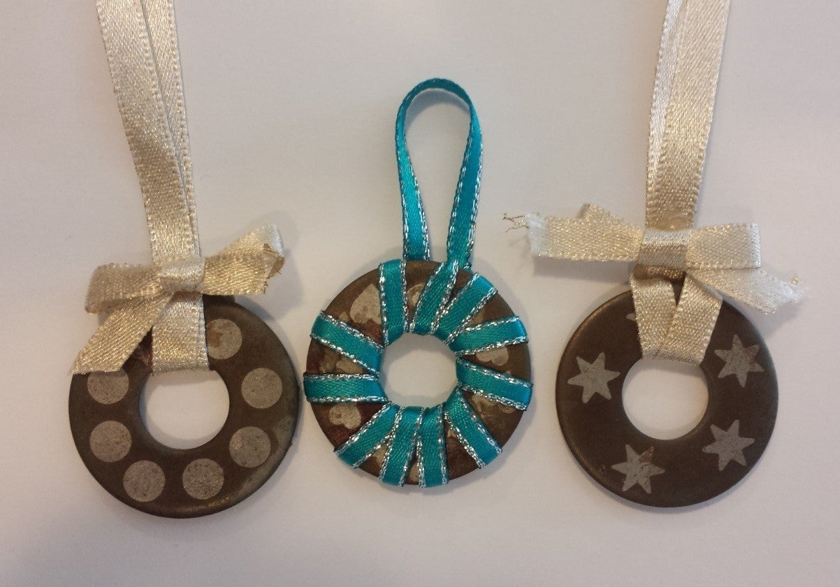 Three metal ring Christmas ornaments.