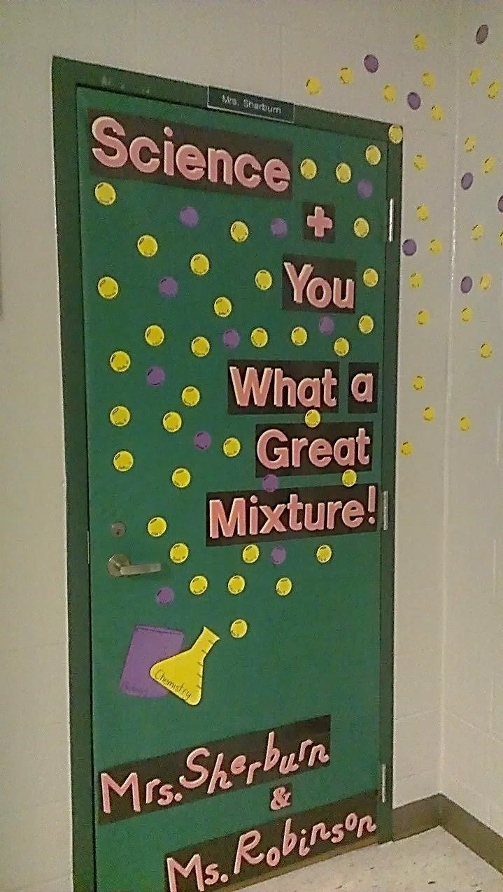 Decorated classroom door with beakers and bubbles.