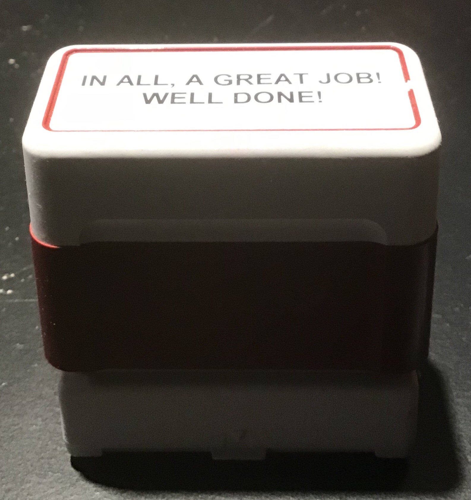 an ink stamp that says &quot;In all, a great job! Well done!&quot;