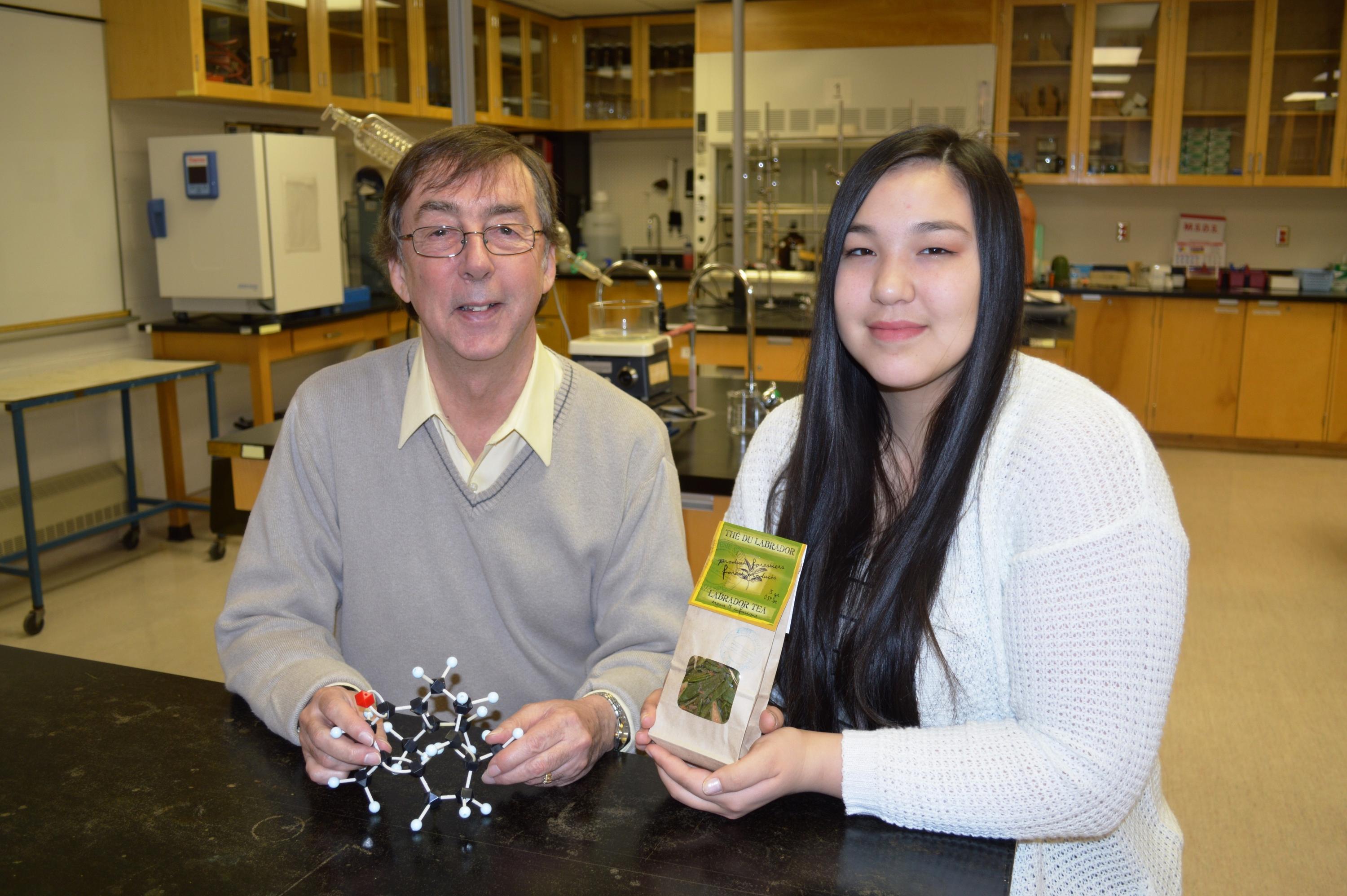 Geoff Rayner-Canham holid a ball-and-stick model of the active constituent, germacrone and Chaim Christiana Andersen is holding a pack of Labrador tea