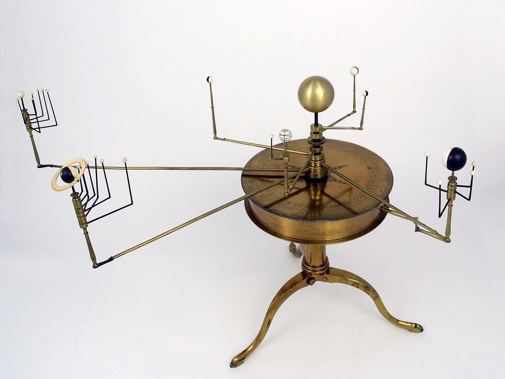 A mechanical heliocentric orrery made by R. B. Bate, circa 1812, showing the orbits of the planets and their moons