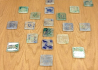 Glass tiles removed from their plaster molds 