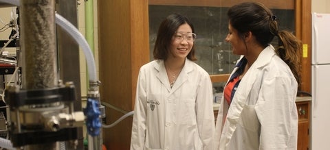 Two women in a lab talking