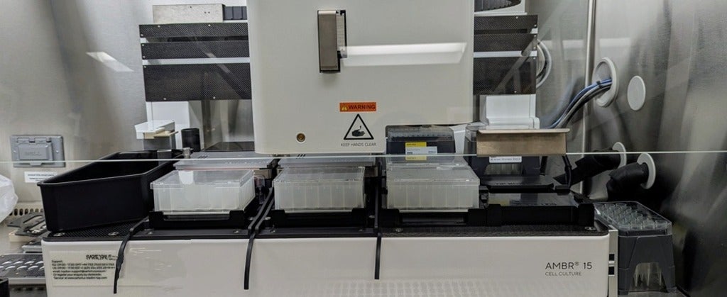 white lab equipment with three trays