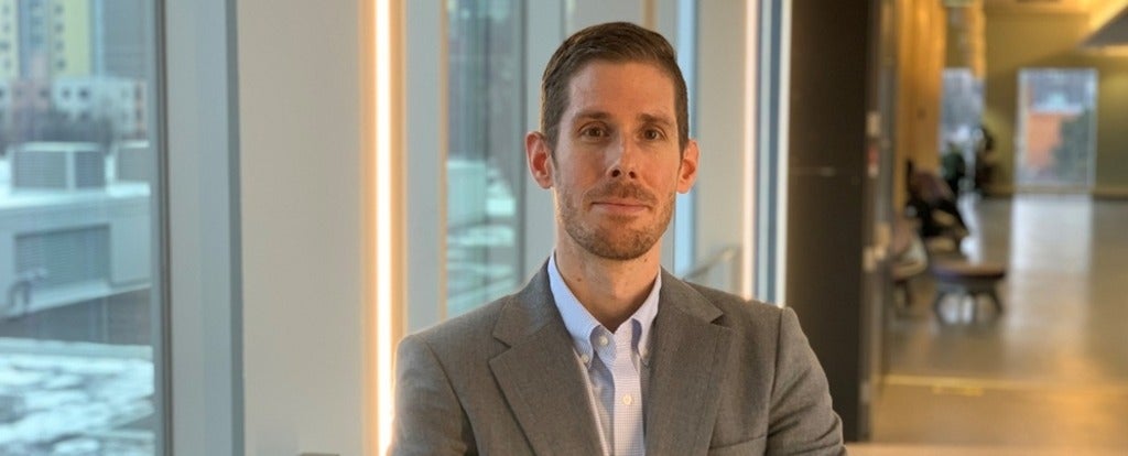 a man with a beard and moustache smiling