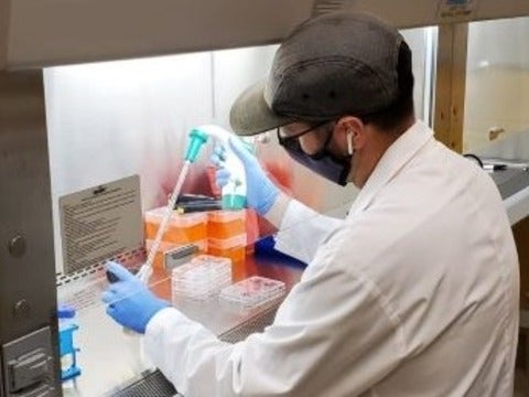 PhD candidate Mark Bruder prepares materials in the lab.