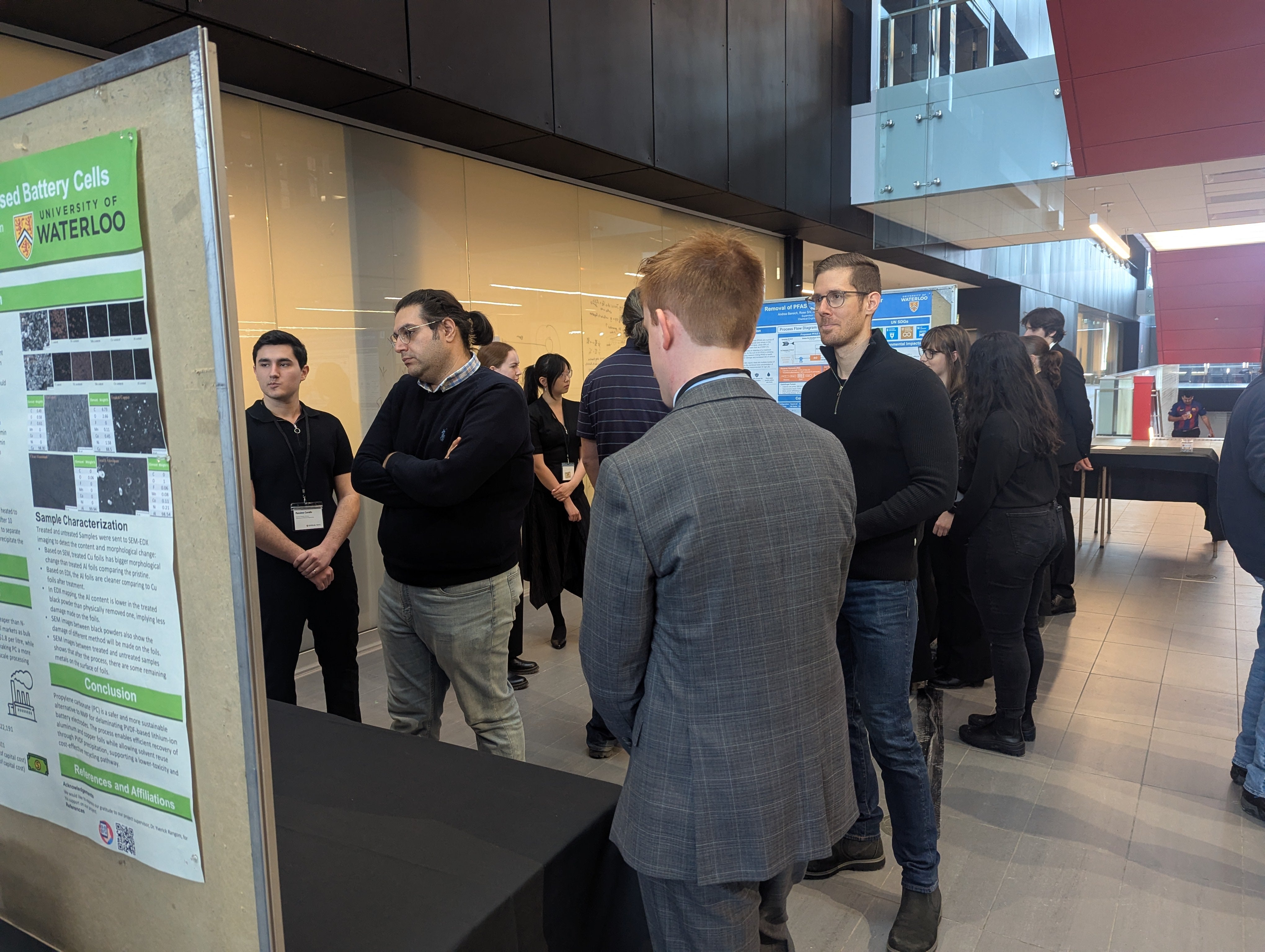 men standing around a poster board