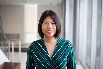 a woman in a stripped green dress