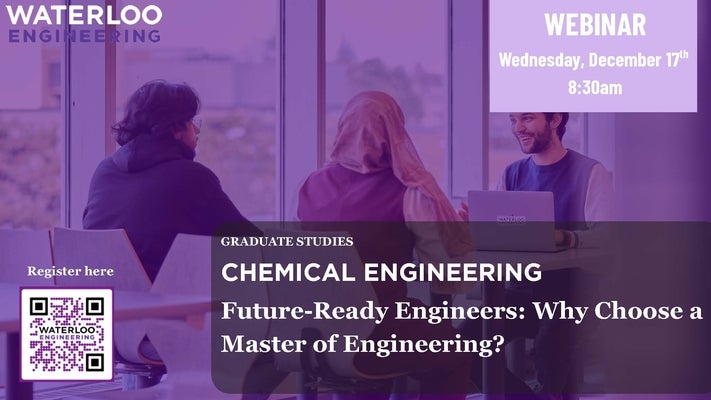 Two women and a smiling man sitting at a table