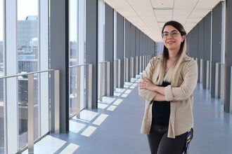 A woman standing with her arms crossed